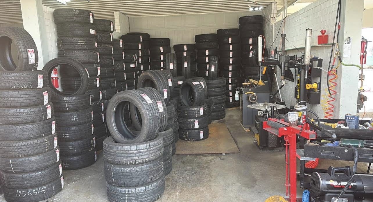 Wall of new and used tire inventory